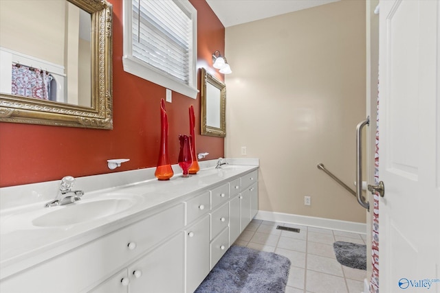 full bathroom with double vanity, visible vents, a sink, and tile patterned floors