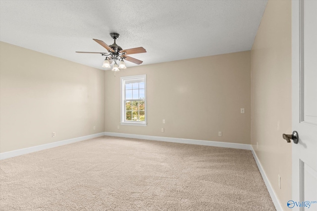 unfurnished room with ceiling fan and light colored carpet