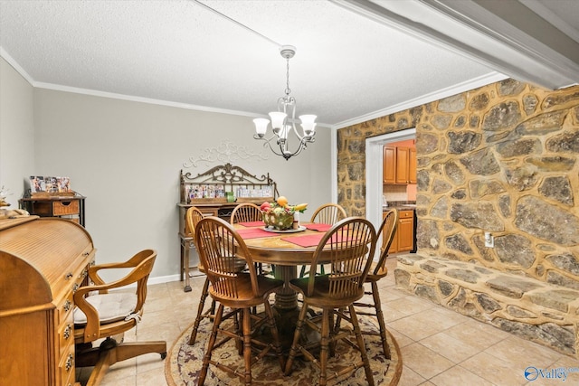 dining area with light tile patterned floors, ornamental molding, a textured ceiling, and a notable chandelier