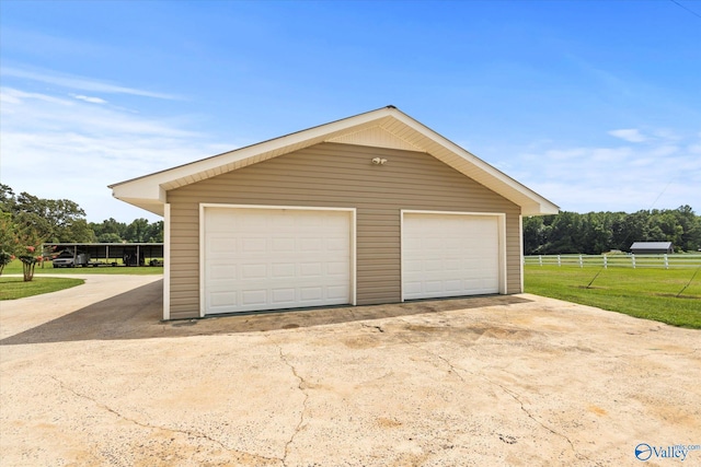 garage with a lawn