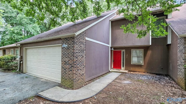 306 Autumn Ln, Madison, AL 35758 - view of front of property with brick siding, a garage, and driveway