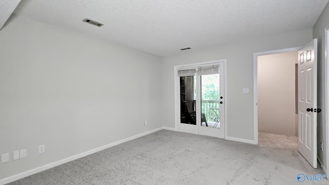 306 Autumn Ln, Madison, AL 35758 - spare room featuring a textured ceiling and carpet floors