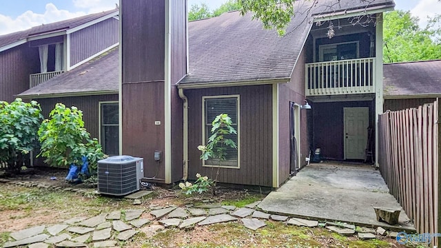 306 Autumn Ln, Madison, AL 35758 - back of property with a shingled roof and a balcony