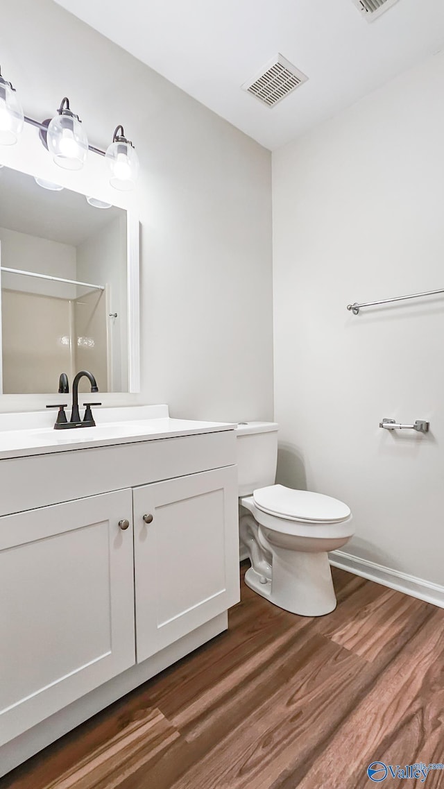 306 Autumn Ln, Madison, AL 35758 - bathroom featuring vanity, a shower, and wood finished floors
