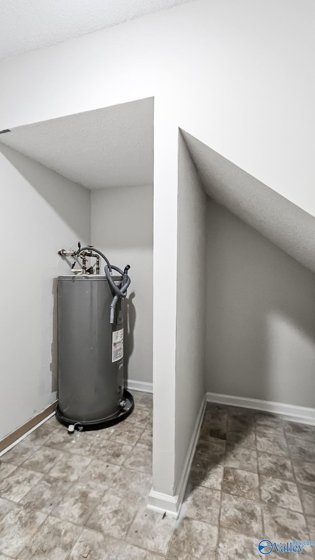306 Autumn Ln, Madison, AL 35758 - detailed view of water heater and a textured ceiling
