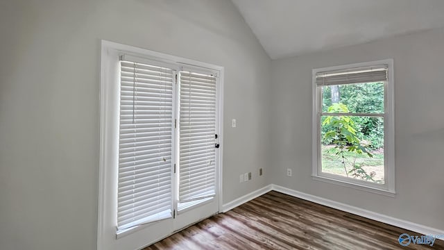 306 Autumn Ln, Madison, AL 35758 - spare room with lofted ceiling and wood finished floors