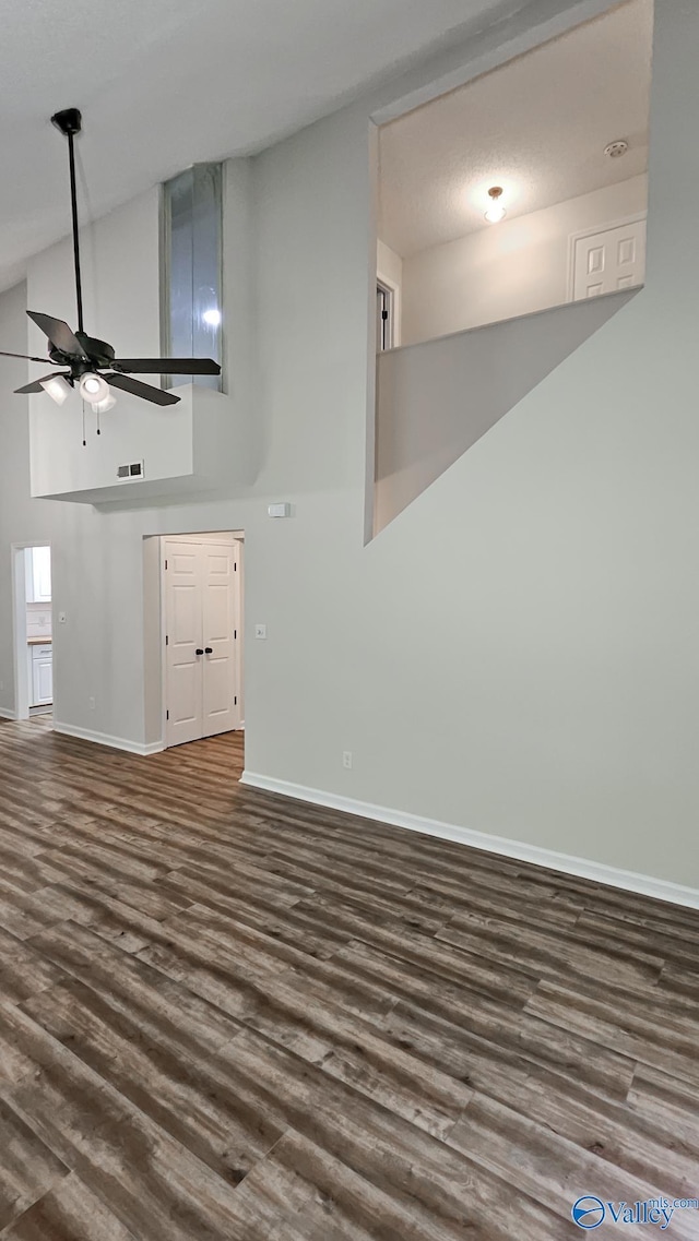306 Autumn Ln, Madison, AL 35758 - spare room featuring a ceiling fan, dark wood finished floors, and high vaulted ceiling