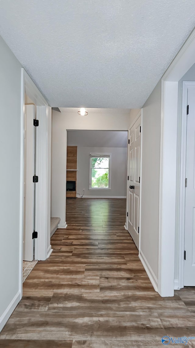 306 Autumn Ln, Madison, AL 35758 - hallway with wood finished floors and a textured ceiling