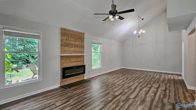 306 Autumn Ln, Madison, AL 35758 - unfurnished living room featuring dark wood-type flooring, a tiled fireplace, a ceiling fan, and lofted ceiling