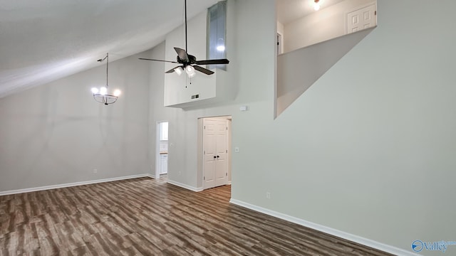 306 Autumn Ln, Madison, AL 35758 - spare room with high vaulted ceiling, dark wood finished floors, ceiling fan, and a chandelier