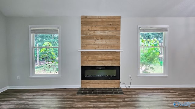 306 Autumn Ln, Madison, AL 35758 - unfurnished living room with wood finished floors and a tiled fireplace