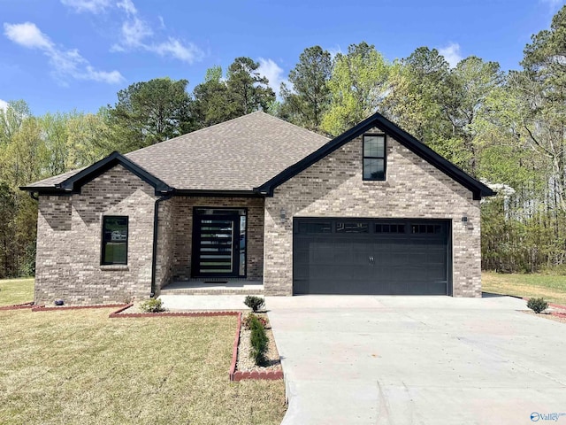 347 Rustic Trce, Grant, AL 35747 - view of front of property featuring driveway, brick siding, a shingled roof, a front lawn, and a garage