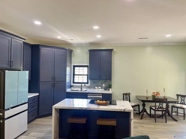 347 Rustic Trce, Grant, AL 35747 - kitchen with freestanding refrigerator, a sink, crown molding, light wood finished floors, and recessed lighting