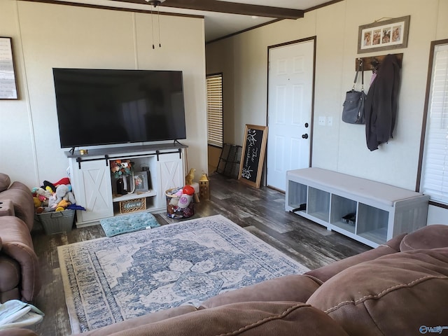living room featuring beamed ceiling and wood finished floors