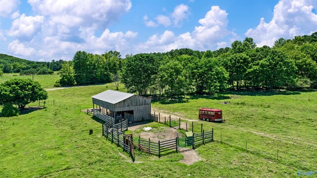 birds eye view of property with a rural view