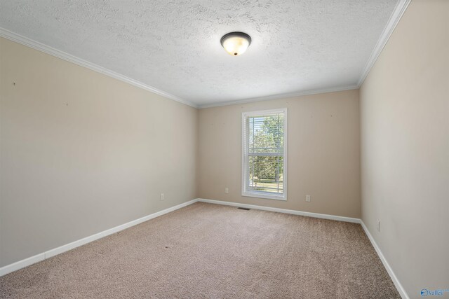 carpeted empty room with a textured ceiling and crown molding