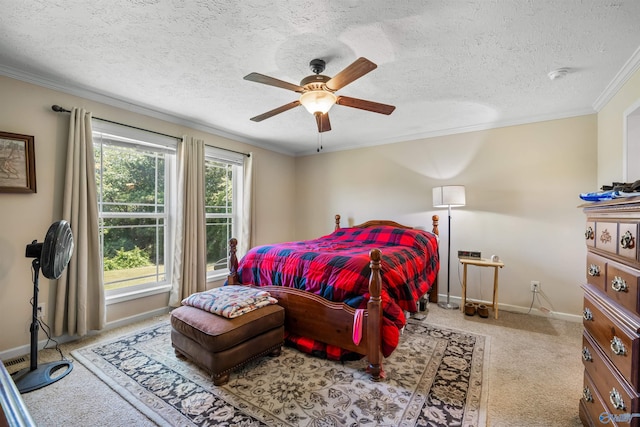 carpeted bedroom featuring a textured ceiling, ceiling fan, and crown molding