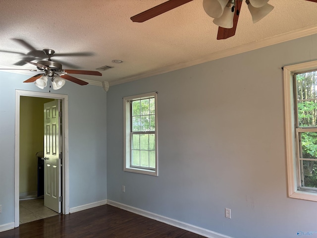 162 Forest Chapel Rd, Hartselle, AL 35640 - empty room featuring a ceiling fan, dark wood finished floors, ornamental molding, and a textured ceiling