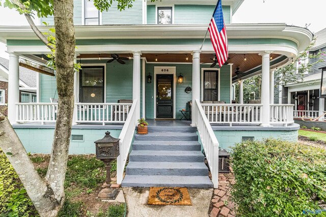 property entrance featuring ceiling fan and a porch