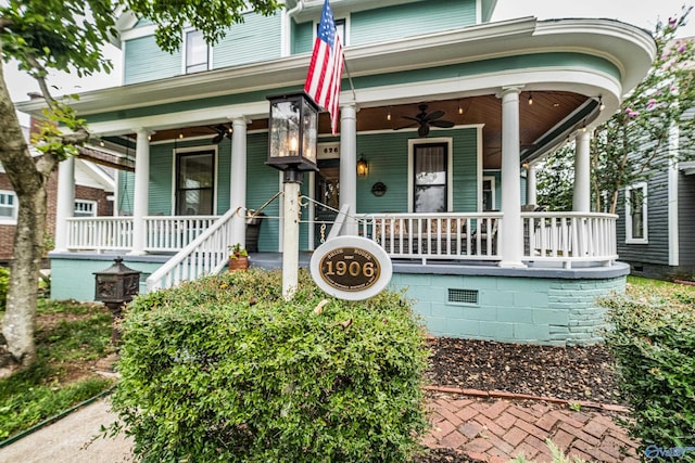 doorway to property with ceiling fan and a porch