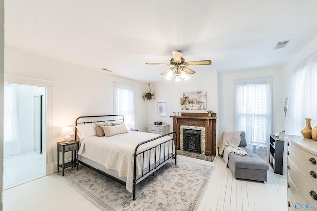 bedroom with ceiling fan and light hardwood / wood-style floors