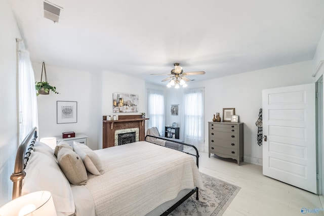 bedroom featuring ceiling fan and light wood-type flooring