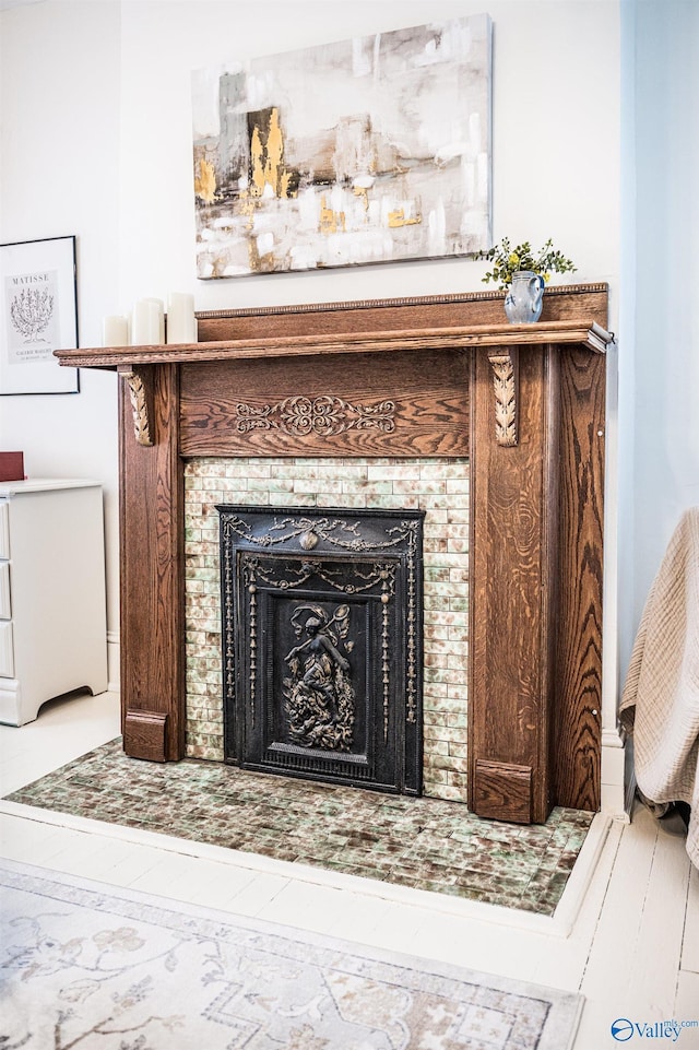 room details featuring a tile fireplace