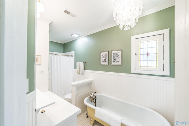 bathroom with a notable chandelier, a tub to relax in, ornamental molding, and toilet