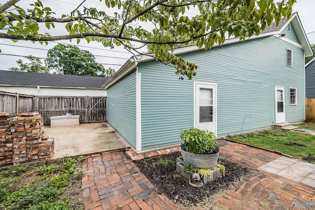 exterior space with a patio area and fence