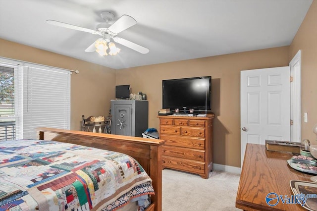 bedroom featuring light carpet and ceiling fan