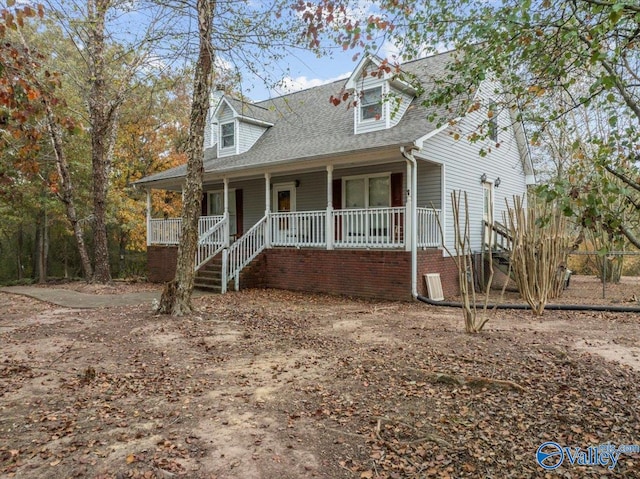 new england style home with covered porch