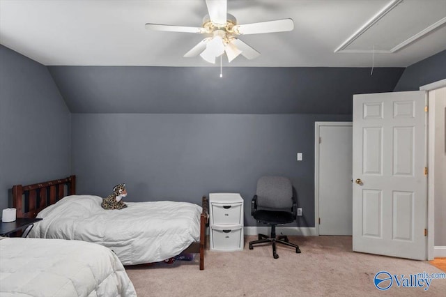 bedroom featuring vaulted ceiling, light colored carpet, and ceiling fan