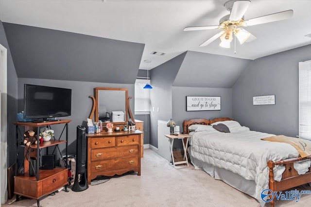 carpeted bedroom featuring vaulted ceiling and ceiling fan