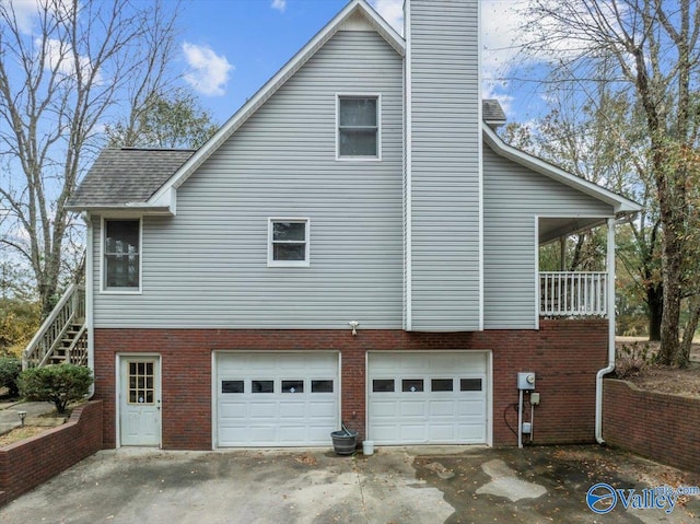 view of side of property with a garage