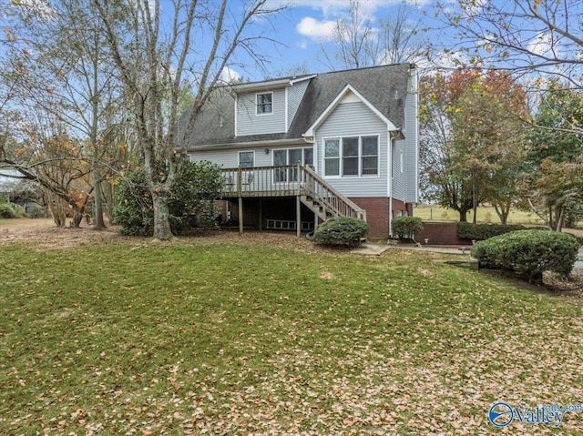 back of property with a deck and a lawn