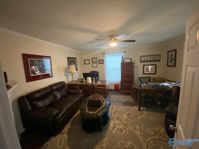 living area featuring ornamental molding and a ceiling fan