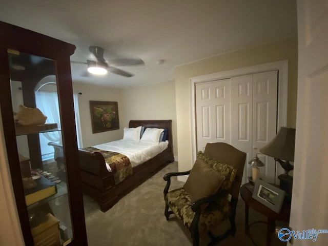 carpeted bedroom with a closet and a ceiling fan