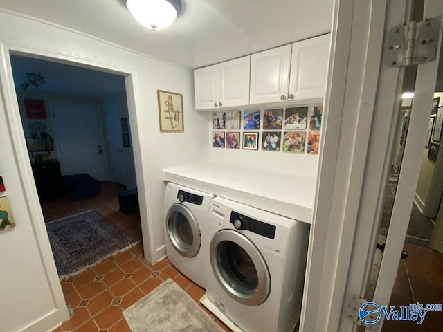 laundry area featuring cabinet space and washer and clothes dryer