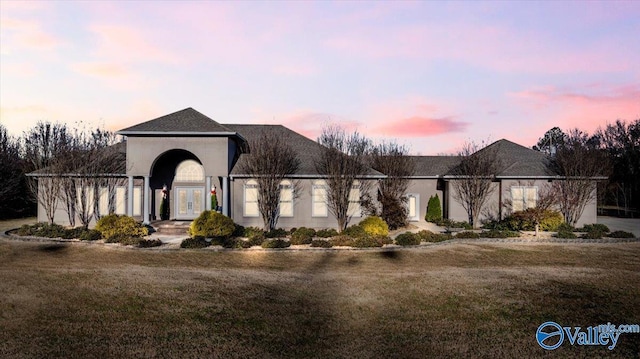 view of front of house with a yard