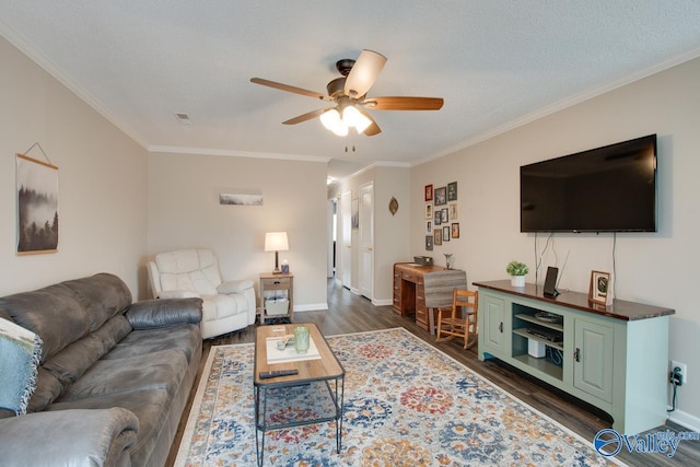 living room with a textured ceiling, ceiling fan, dark hardwood / wood-style flooring, and crown molding