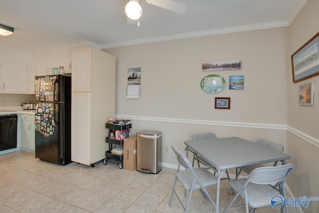 tiled dining room with ceiling fan and ornamental molding