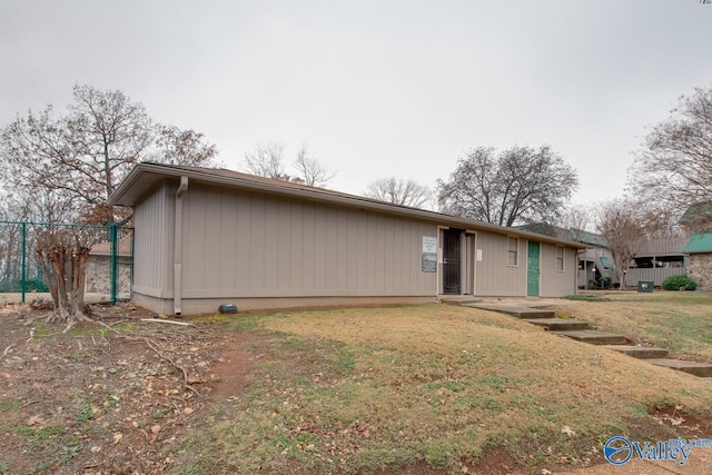 back of house with a yard