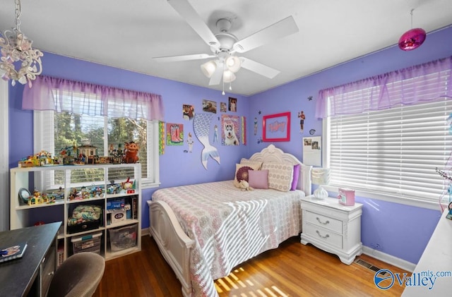 bedroom featuring ceiling fan and wood-type flooring