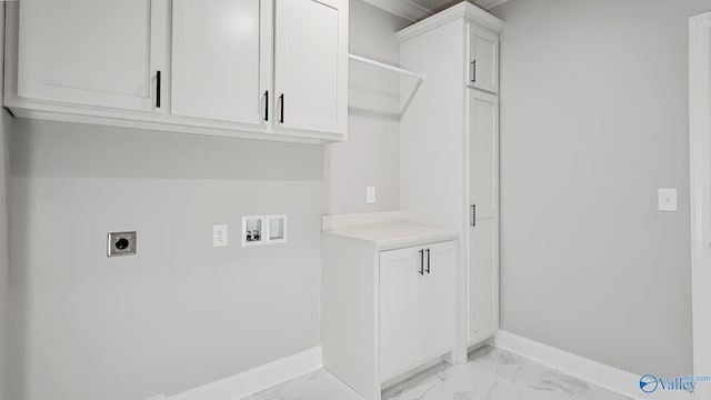 clothes washing area with marble finish floor, electric dryer hookup, hookup for a washing machine, and baseboards