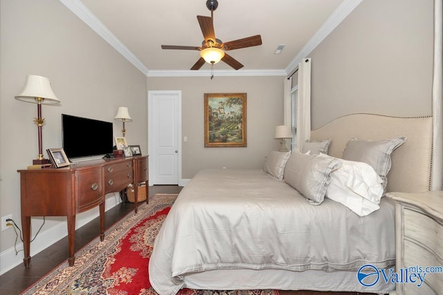 bedroom with crown molding, dark hardwood / wood-style flooring, and ceiling fan