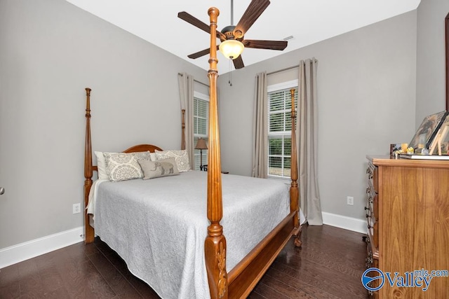 bedroom with dark wood-type flooring and ceiling fan