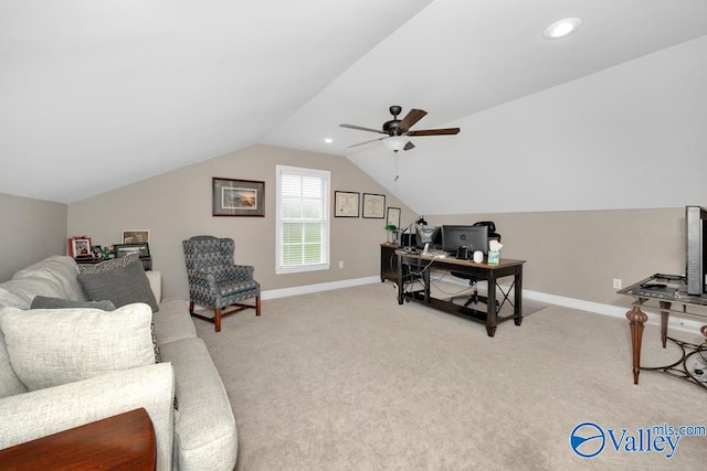 home office with lofted ceiling, ceiling fan, and light colored carpet