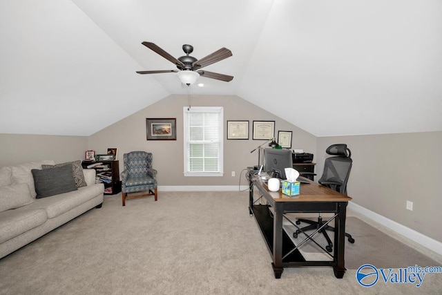 office area featuring ceiling fan, light colored carpet, and vaulted ceiling