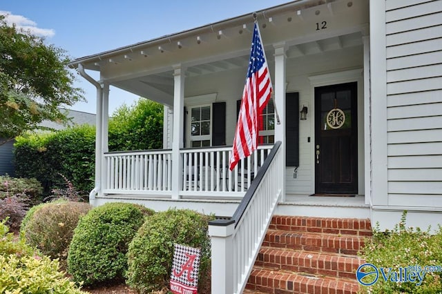 doorway to property featuring covered porch