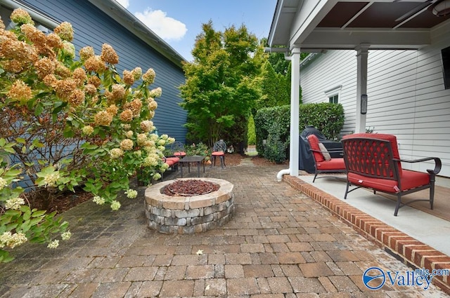 view of patio / terrace with an outdoor fire pit